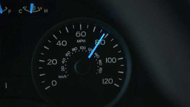 Speedometer reaching 80 MPH while driving