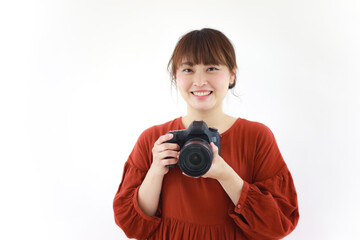 Fototapeta premium 一眼レフカメラを持つ女性