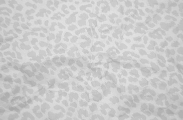 Crumpled wrapping paper gray background. Leopard pattern. 