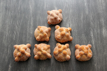 Fluffy, sugary, fresh and delicious Mexican pan de muerto for the season of the traditional holiday of the Day of the Faithful Dead and All Saints in November
