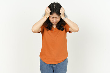 Beautiful Asian Woman Wearing Orange Color T-Shirt having headache  Isolated On White Background