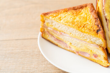 sandwich ham cheese on white plate