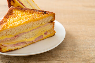 sandwich ham cheese on white plate