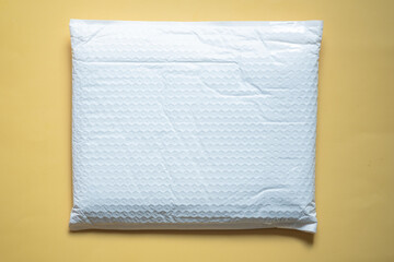 Used white envelope made of bubble wrap for prevent something from bumping.