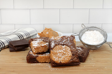 Peanut Butter swirl brownies sprinkled with powdered sugar.