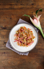 Teri Kecombrang or fried anchovy spicy with kecombrang or honje or kincung fragrant edible flower. 