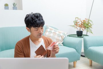Young man using laptop computer. Online shopping concept