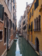 Fototapeta na wymiar Canal Amidst Buildings In City