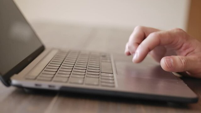 Man typing on the keyboard. hands of a young man close up. High quality FullHD footage
