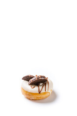 Photograph of a white chocolate donuts with dark chocolate cookies on a white background.The photo is shot in vertical format.