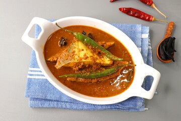 Goa Food - Indian Traditional Goan Pomfret or butterfish curry. Hot and spicy homemade fish gravy...
