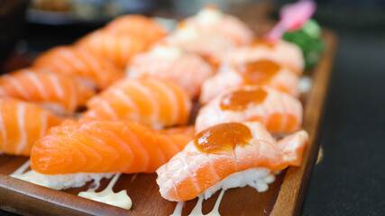 Salmon Sushi Japanese food. on the table in restaurant. Japanese cuisine set of Sashimi Salmon sushi nigiri. 