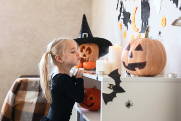 A girl on Halloween dressed in a witch costume