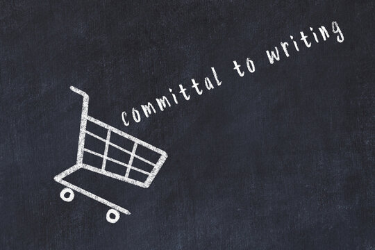 Chalk drawing of shopping cart and word committal to writing on black chalboard. Concept of globalization and mass consuming