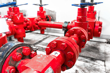 Petroleum oil and gas drilling equipment. Choke and kill manifolds are wellhead equipments that are assembled on the blowoul preventer units. Piping and valve system on offshore wellhead platform. - obrazy, fototapety, plakaty