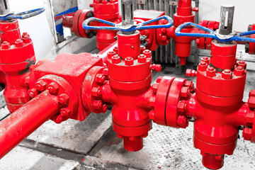 Petroleum oil and gas drilling equipment. Choke and kill manifolds are wellhead equipments that are assembled on the blowoul preventer units. Piping and valve system on offshore wellhead platform.