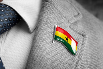 Metal badge with the flag of Ghana on a suit lapel - obrazy, fototapety, plakaty