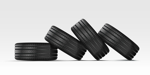 Car tire with cast chrome wheel. A stack of car tires lie on their sides on top of each other. 4 rubber wheels for summer and winter on a white background. - obrazy, fototapety, plakaty
