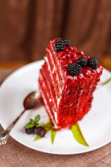 Red Velvet cake, chocolate cake of dark red, bright red or red-brown color, traditionally prepared as a layer cake with cream cheese glaze, cream cheese glaze or cream glaze used, cut, selective focus