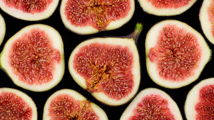 Figs. Sliced fresh figs top view. Figs Isolated on black Background