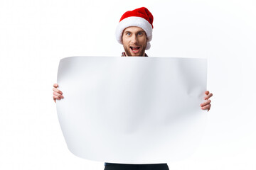 emotional man in a christmas hat with white mockup poster christmas isolated background