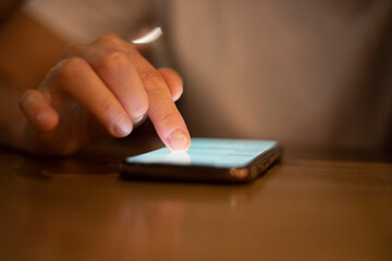 blurred choosing and ordering food using a smartphone during a pandemic, horizontal.