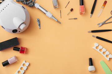 Set of tools for manicure on color background
