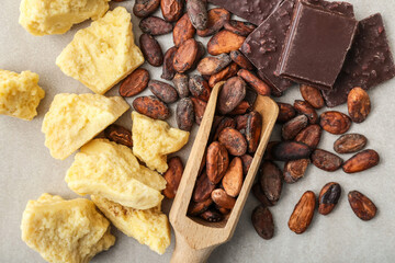 Composition with cocoa butter on light background