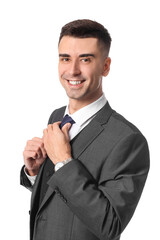 Handsome young man in stylish formal suit on white background