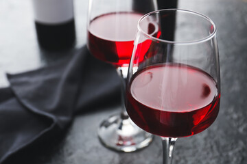 Glass of red wine on dark background, closeup