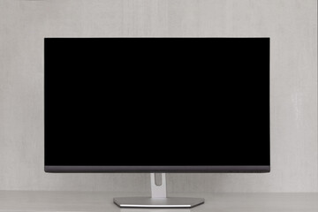mock up computer monitor with a black screen on a grey background