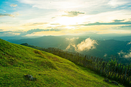 sunset view on the top of the mountain in the forest nature