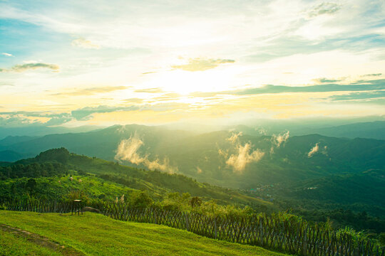 sunset view on the top of the mountain in the forest nature