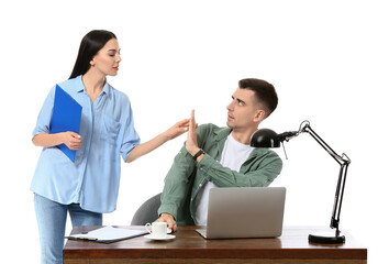 Beautiful young secretary seducing her boss on white background. Concept of harassment