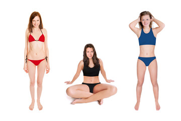 Three cheerful young woman wearing different swimwear, studio photo isolated in front of white background