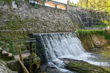View to Dam on the Lomnica River, semicircular dam with five overflows, on the Lomnica River, in Karpacz, Poland
