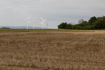 Several wind turbines in a rural area in Germany 