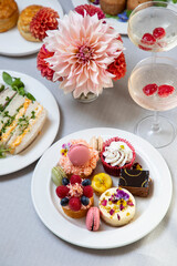 English afternoon tea with cakes and sandwiches