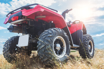 ATV on the field in sunlight © Yuri Bizgaimer