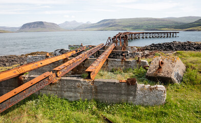 Fototapeta na wymiar Details (old pier) of an abandoned naval base on Iceland (Hvítanes, Hvalfjördur)