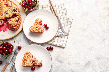 Composition with pieces of tasty cherry pie on light background