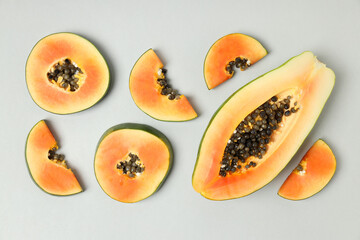 Flat lay with papaya on light gray background