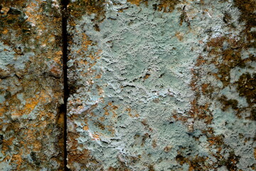 Closeup old brick wall with lots of stains