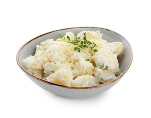 Bowl of delicious gnocchi with creamy sauce on white background