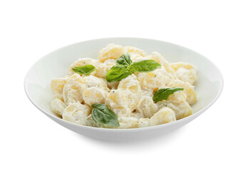 Bowl of delicious gnocchi with creamy sauce on white background