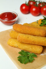 Concept of tasty food with cheese sticks on white background