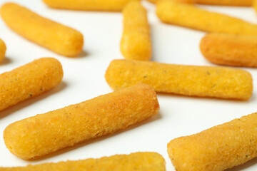 Cheese sticks on white background, close up