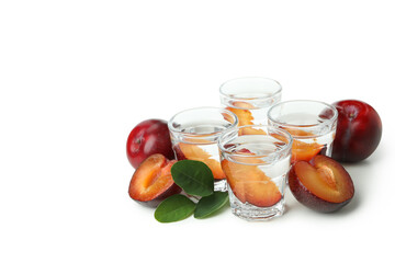 Plum vodka shots isolated on white background