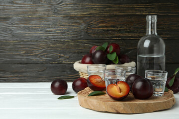 Concept of alcohol with plum vodka, space for text