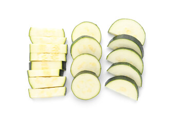 Slices of fresh zucchini squash on white background